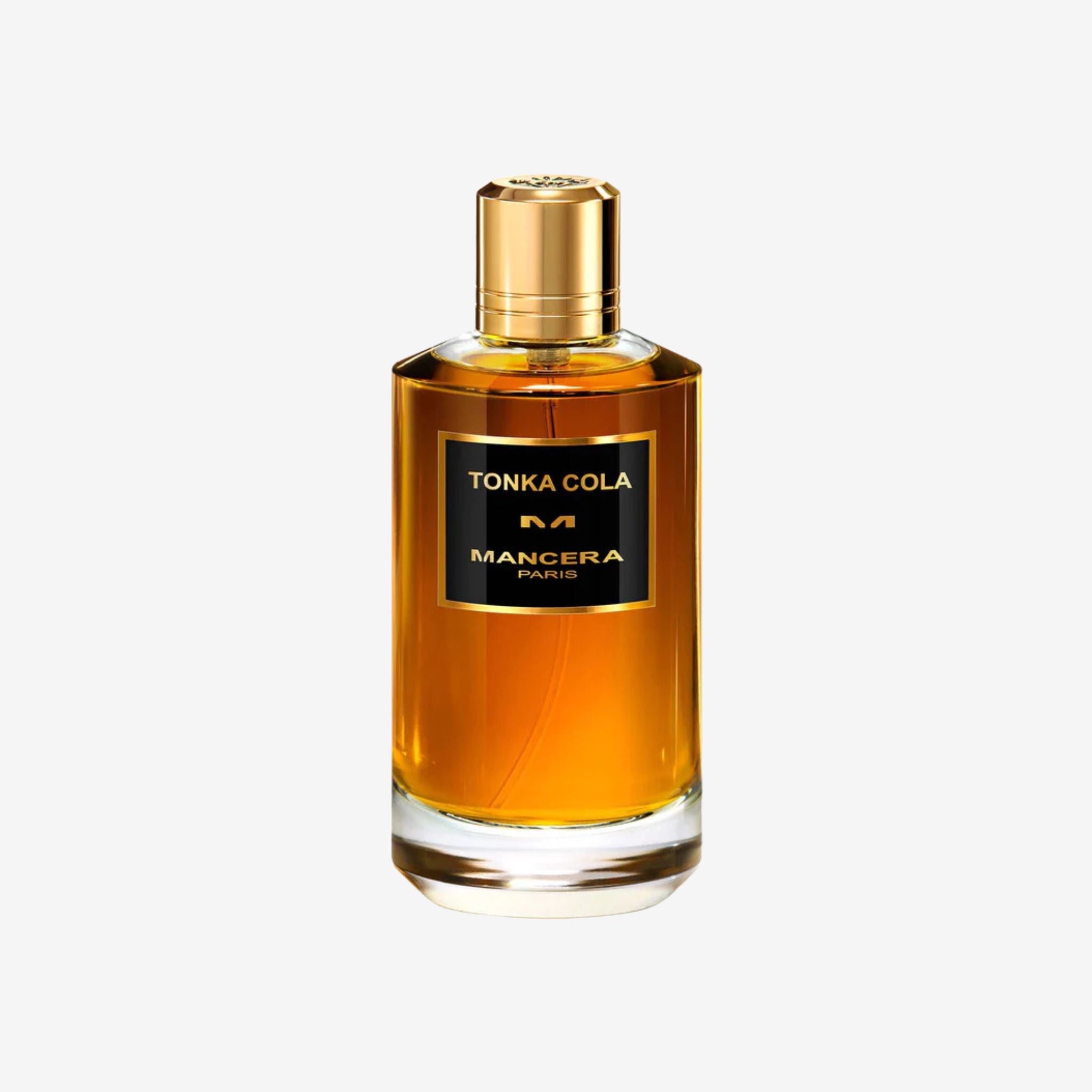 Mancera Tonka Cola 120 ml Eau de Parfum bottle on cream background – clear glass flacon with gold cap, showcasing dark amber fragrance for men and women.